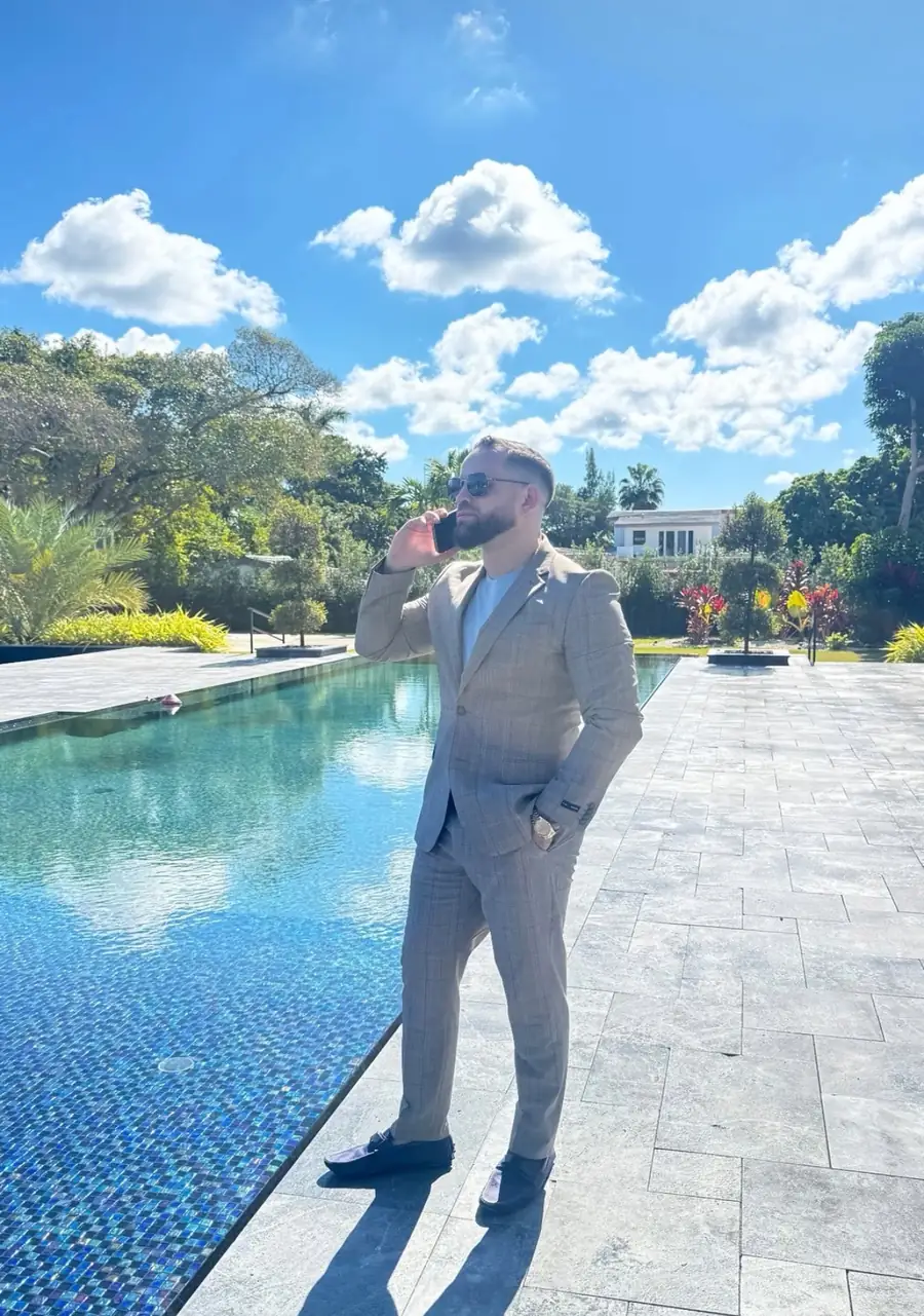 Armando Perez on a call at a South Florida property